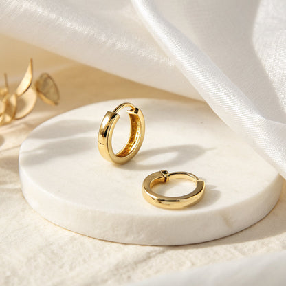 gold huggie earrings - Hezura